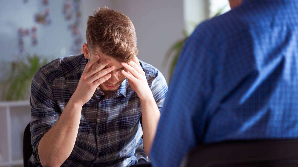 Man talking to his therapist about ego in recovery. 