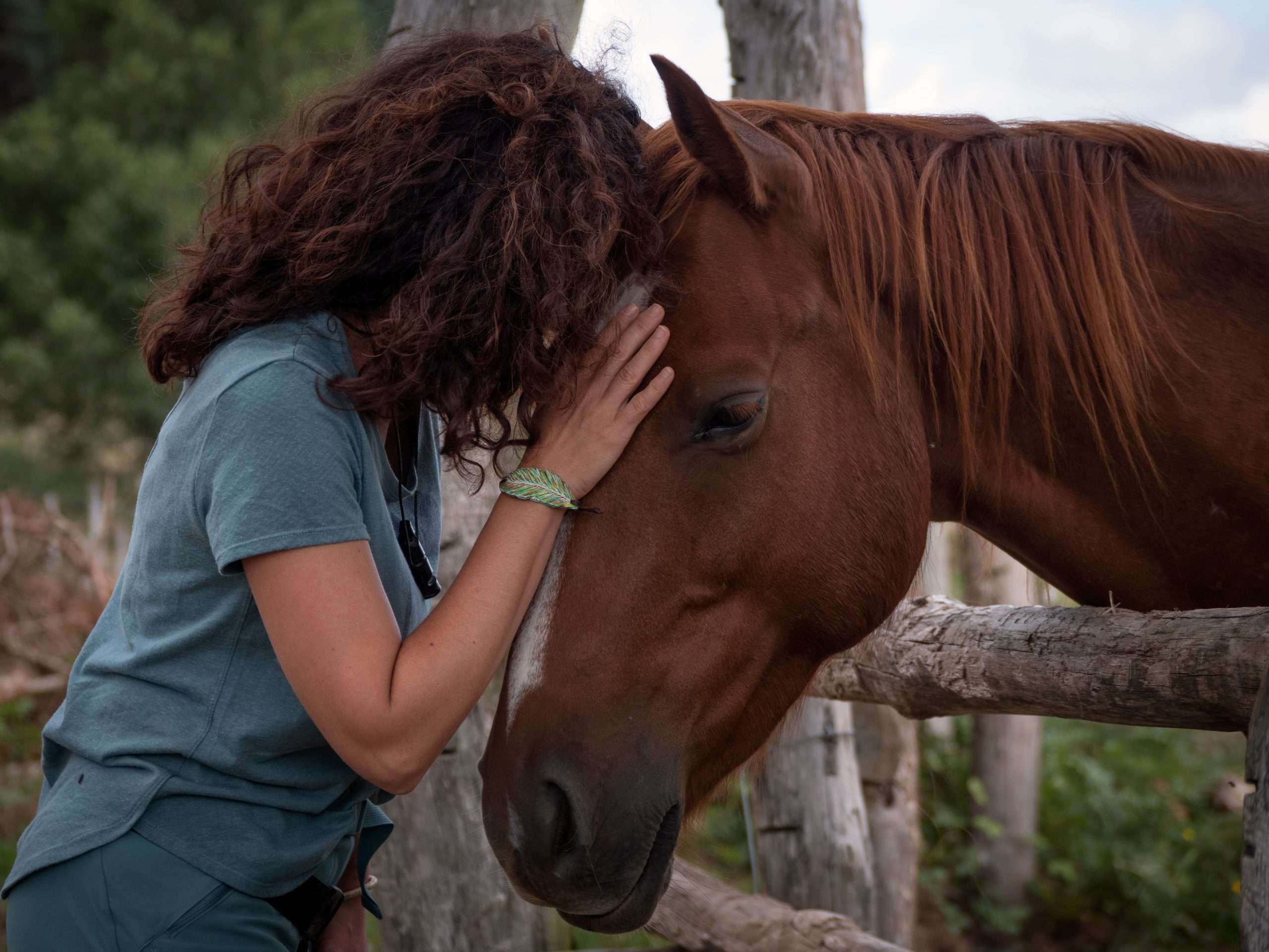A woman enjoying equine therapy in Utah.