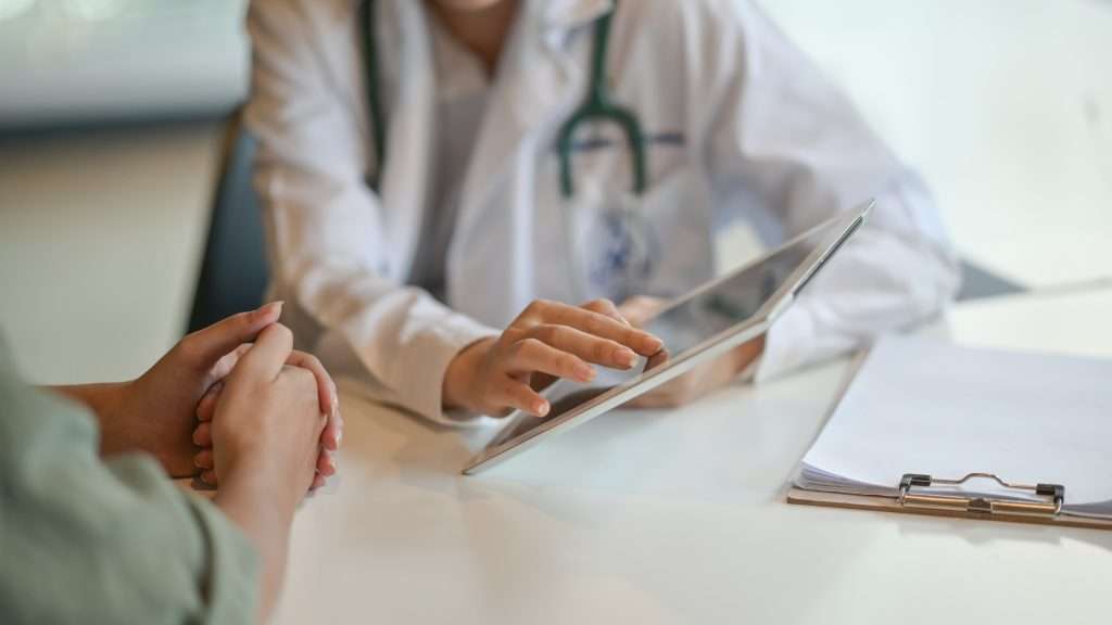 A doctor providing medication management during rehab in Eden, Utah