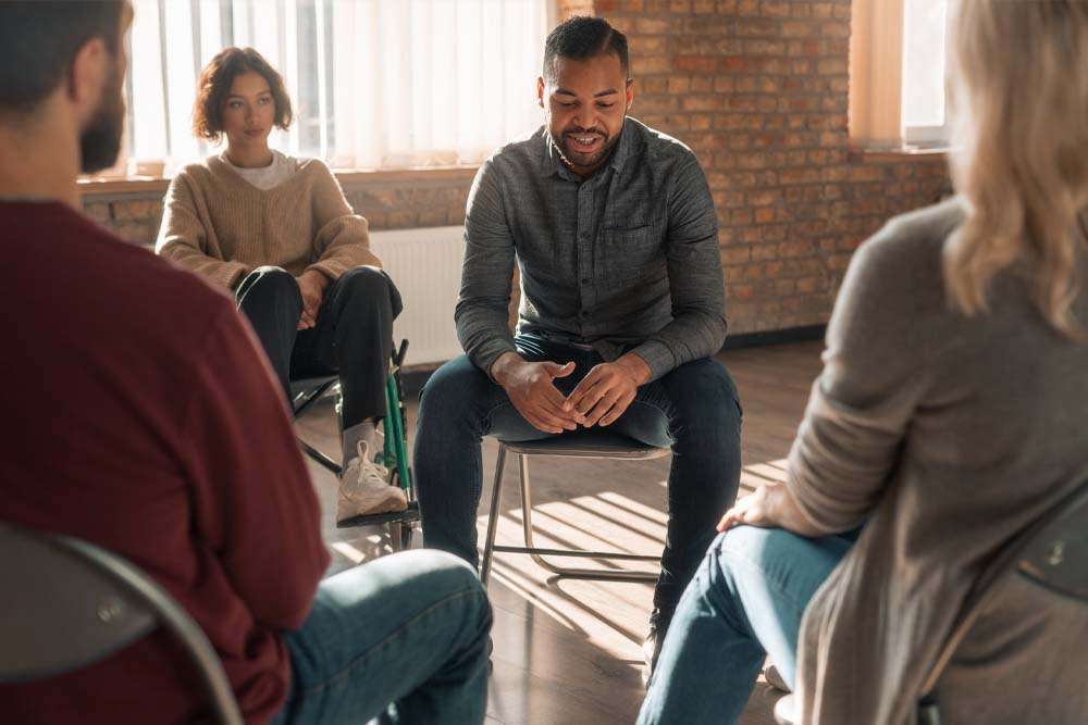 A man talks about what led him to seek prescription drug rehab in utah during a group therapy exercise.