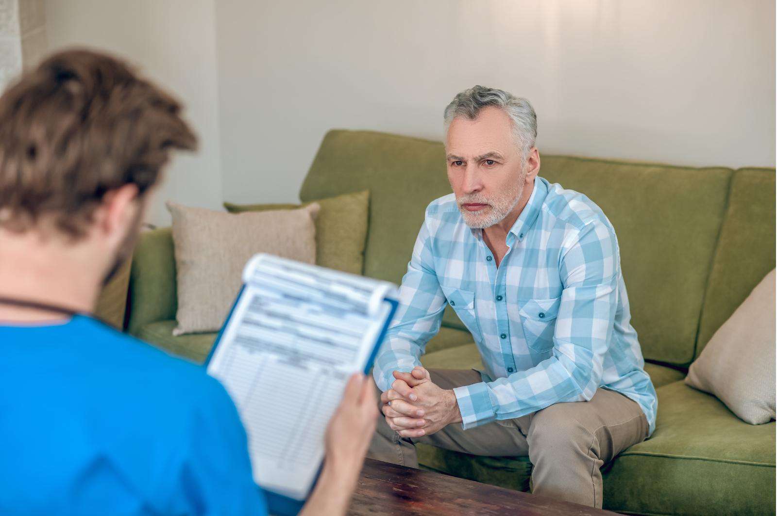 Specialist managing medications for a client during alcohol detox in Utah.